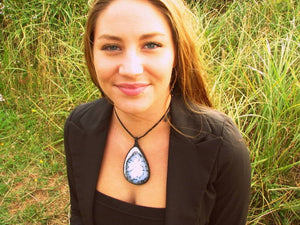 Model is wearing a beautiful tear drop Dendrite Opal macrame necklace, black and white agate pendant