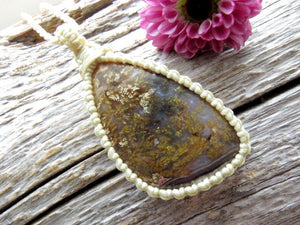 pretty plume agate macrame necklace, plume agate with brown plumes wrapped in beige cord