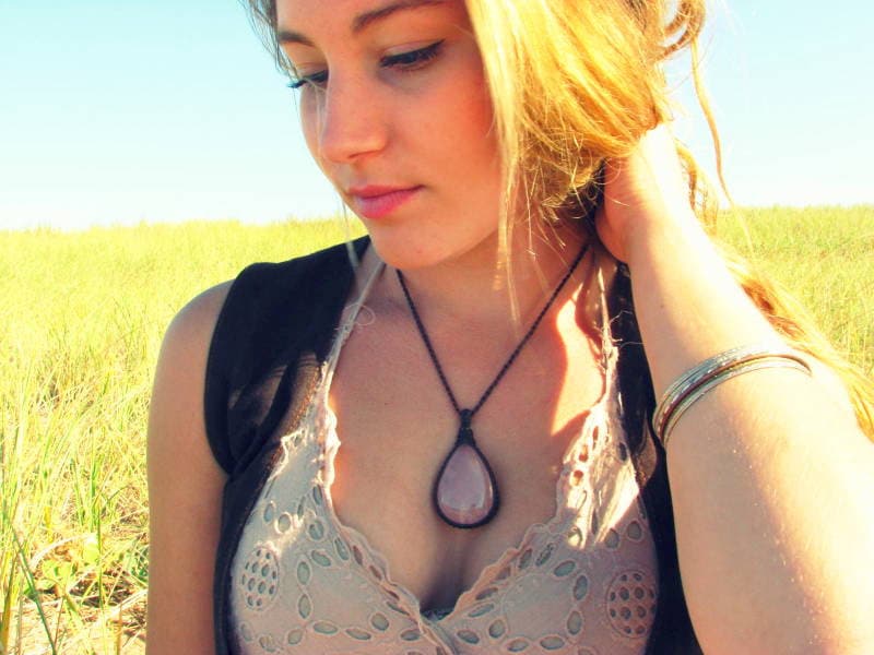 Model wearing a soft pink teardrop Rose quartz crystal necklace, wrapped Rose Quartz necklace