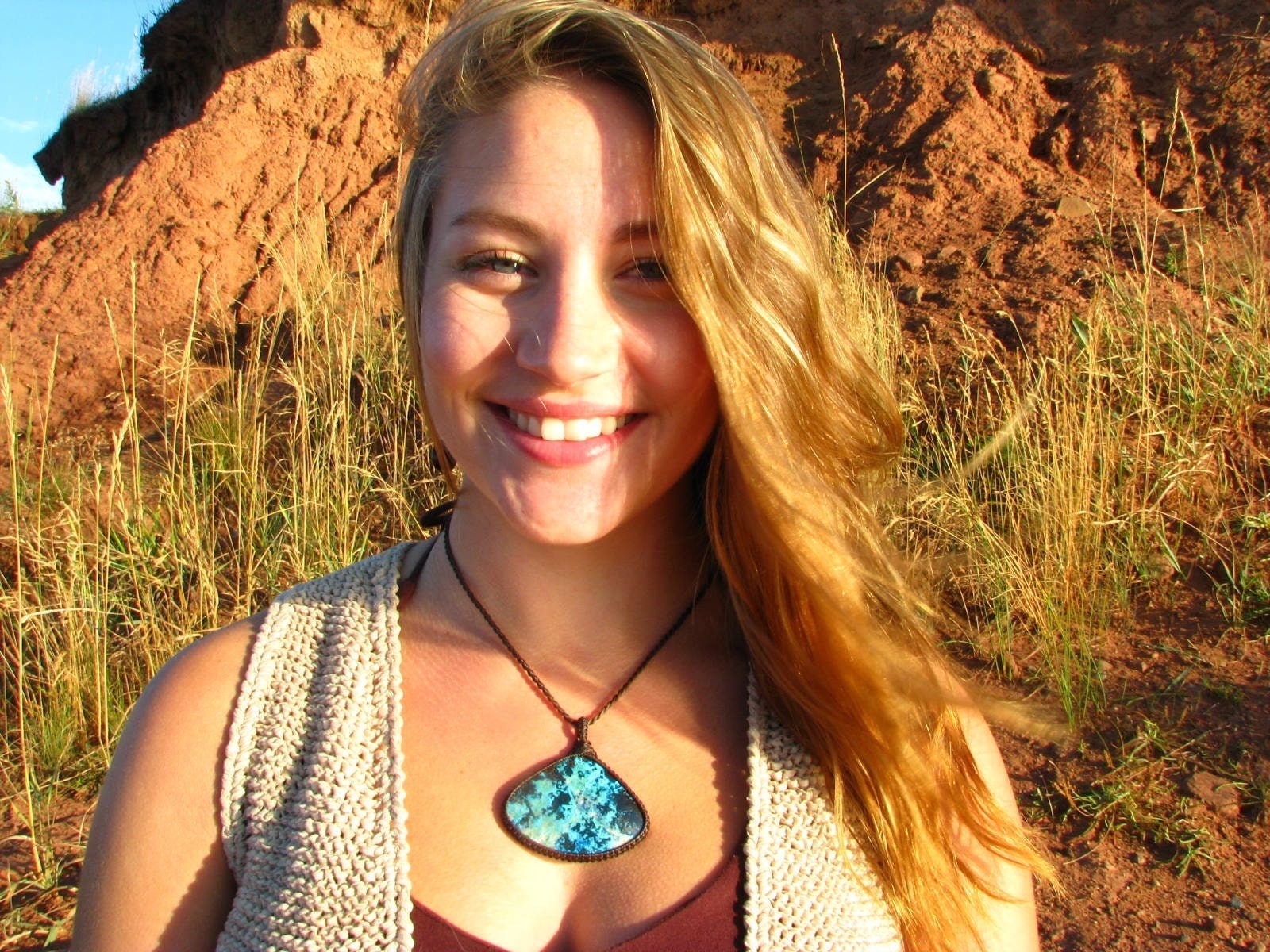model wearing large teardrop Azurite gemstone necklace, pretty blue azurite macrame necklace wrapped in dark brown (almost black) cord