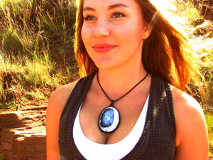 Model wearing a beautiful black and white oval shaped Dendrite Opal gemstone necklace, Agate