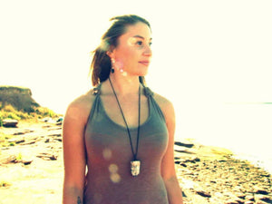 Model is wearing Quartz crystal necklace on a long 26 inch cord,, Fire and Ice Quartz,