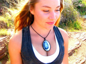 Model wearing Dendrite Opal (Merlinite) gemstone necklace, macrame necklace wrapped in black cord