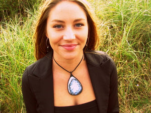 Model is wearing a beautiful tear drop Dendrite Opal macrame necklace, black and white agate pendant