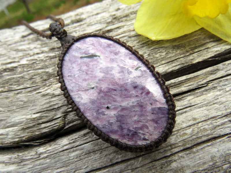 Model is wearing a light purple oval shaped Charoite necklace, Charoite macrame gemstone necklace,