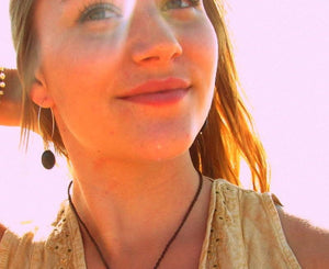 model wearing labradorite earrings